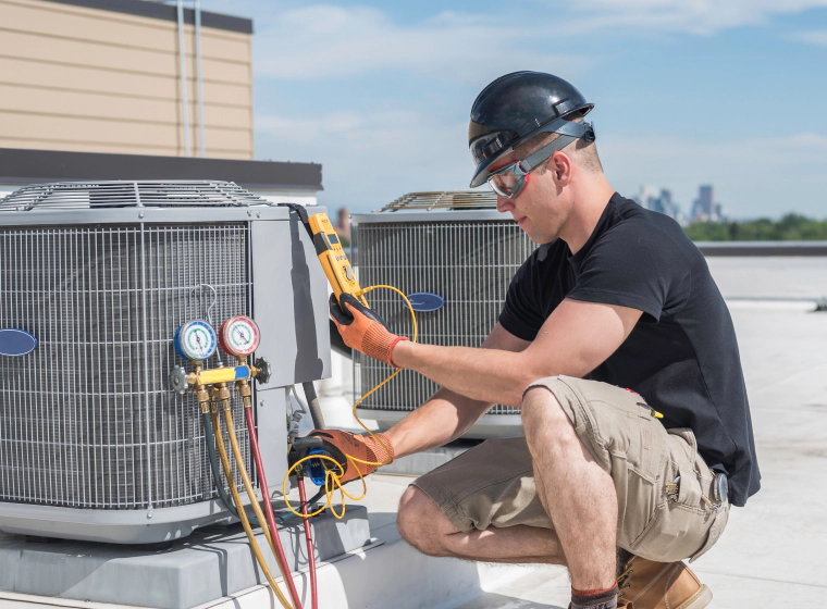 technician inspecting central ac unit acworth ga
